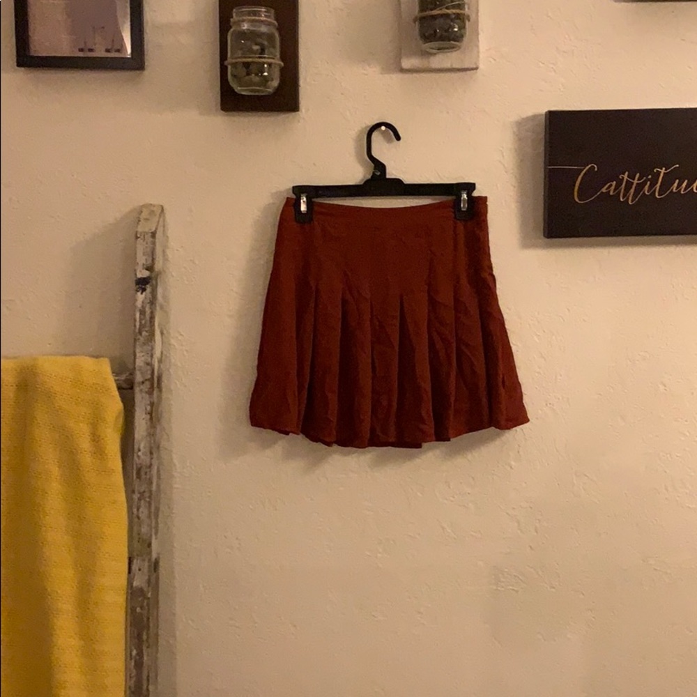 Orange pleated skirt